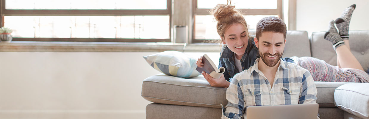 couple using laptop at home